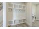 Well-organized mudroom with storage cubbies, seating, and hooks, blending functionality with clean, modern design at 7053 Byrnes Ln., Myrtle Beach, SC 29588