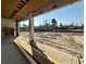 Covered patio area under construction with view of treed backyard and lake at 7053 Byrnes Ln., Myrtle Beach, SC 29588