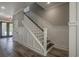 Staircase with white railings and dark wood steps at 7053 Byrnes Ln., Myrtle Beach, SC 29588