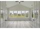 Sunroom with wood flooring, multiple windows, and French doors at 7053 Byrnes Ln., Myrtle Beach, SC 29588