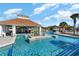 Relaxing pool area with a cabana and tropical landscaping at 7075 Shooting Star Way, Myrtle Beach, SC 29579