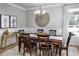 Formal dining room with wood table and statement wall decor at 719 Isle Verde Dr, Myrtle Beach, SC 29579