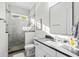 Modern bathroom with a walk-in shower and gray vanity at 744 Crystal Water Way, Myrtle Beach, SC 29579