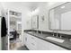 Double vanity bathroom with modern finishes and a view into bedroom at 744 Crystal Water Way, Myrtle Beach, SC 29579