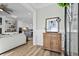 Bright entryway with hardwood floors and antique cabinet at 744 Crystal Water Way, Myrtle Beach, SC 29579