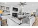 Spacious living room with sectional sofa, fireplace, and built-in shelving at 744 Crystal Water Way, Myrtle Beach, SC 29579