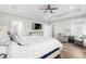 Main bedroom with large TV, sitting area and ample natural light at 744 Crystal Water Way, Myrtle Beach, SC 29579