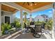 Covered patio with fire pit and seating area, perfect for outdoor entertaining at 744 Crystal Water Way, Myrtle Beach, SC 29579