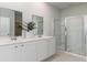 Bathroom with double sinks, a large shower, and white cabinets at 809 Green Garden Way, Myrtle Beach, SC 29579