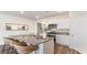 Kitchen island with granite countertops and wicker barstools at 809 Green Garden Way, Myrtle Beach, SC 29579