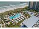 Aerial view of resort pool area and beach at 8560 Queensway Blvd. # 304, Myrtle Beach, SC 29572