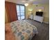 Bedroom with king-size bed, balcony access, and ocean view at 8560 Queensway Blvd. # 304, Myrtle Beach, SC 29572