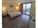 Main bedroom with king-size bed and ocean view at 8560 Queensway Blvd. # 304, Myrtle Beach, SC 29572