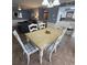 Dining area with table and chairs, view into kitchen and living room at 8560 Queensway Blvd. # 304, Myrtle Beach, SC 29572