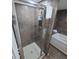 Walk-in shower with tiled walls at 8560 Queensway Blvd. # 304, Myrtle Beach, SC 29572