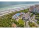 Aerial view of the resort with pools and beach access at 9237 Bellasara Circle, Myrtle Beach, SC 29579