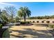 Landscaped backyard with palm trees and a view of the golf course at 9237 Bellasara Circle, Myrtle Beach, SC 29579