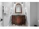 Upscale bathroom featuring a dark wood vanity and large mirror at 9237 Bellasara Circle, Myrtle Beach, SC 29579