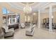 Elegant living room with vaulted ceilings, chandelier, and comfortable seating at 9237 Bellasara Circle, Myrtle Beach, SC 29579