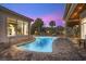 Inviting pool area with a curved design and patio seating at 9237 Bellasara Circle, Myrtle Beach, SC 29579