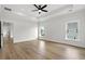 Light and airy bedroom with hardwood floors and multiple windows at 946 Crystal Water Way, Myrtle Beach, SC 29579