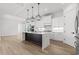 Modern kitchen with white cabinets, marble countertops, and a large island at 946 Crystal Water Way, Myrtle Beach, SC 29579