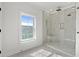 Spa-like shower with marble walls and built-in seat at 946 Crystal Water Way, Myrtle Beach, SC 29579