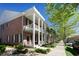 Brick townhouse with white columns, porch, and landscaping at 965 Hackler St. # C, Myrtle Beach, SC 29577