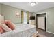 Bedroom with a queen bed, built-in wardrobe and soft green walls at 1010 Shem Creek Circle, Myrtle Beach, SC 29588