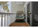 Peaceful balcony featuring a wicker chair, offering a view of the snow-covered trees at 112 Cypress Point Ct. # 202, Myrtle Beach, SC 29579