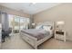 Bright bedroom with a king-size bed, and access to a private balcony at 112 Cypress Point Ct. # 202, Myrtle Beach, SC 29579