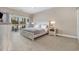 Main bedroom with queen-size bed and access to balcony at 112 Cypress Point Ct. # 202, Myrtle Beach, SC 29579