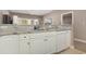 Kitchen with granite countertop and white cabinets at 112 Cypress Point Ct. # 202, Myrtle Beach, SC 29579