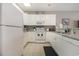 White kitchen with granite countertops and stainless steel appliances at 112 Cypress Point Ct. # 202, Myrtle Beach, SC 29579