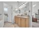 Bathroom with double sinks, large mirror, and access to bedroom at 116 Cobblestone Dr., Pawleys Island, SC 29585