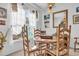 Round wooden table with four chairs in a bright dining area at 116 Cobblestone Dr., Pawleys Island, SC 29585