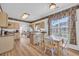 Bright kitchen with an island, stainless steel appliances, and light wood cabinets at 116 Cobblestone Dr., Pawleys Island, SC 29585