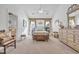 Bright main bedroom with carpeted floors and en-suite bathroom at 116 Cobblestone Dr., Pawleys Island, SC 29585