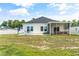 Home exterior with a large backyard and screened porch at 124 Marley Blue Dr., Little River, SC 29566