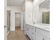 Double vanity bathroom with a walk-in shower and tile floors at 124 Marley Blue Dr., Little River, SC 29566