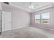 Bright bedroom featuring neutral walls and two large windows at 124 Marley Blue Dr., Little River, SC 29566