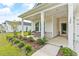 Inviting front porch with sitting area, perfect for relaxing outdoors at 124 Marley Blue Dr., Little River, SC 29566