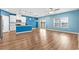 Spacious living room featuring light wood floors and blue walls at 124 Marley Blue Dr., Little River, SC 29566