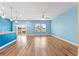 Spacious living area with hardwood floors and blue walls at 124 Marley Blue Dr., Little River, SC 29566