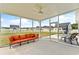 Relaxing screened porch overlooking backyard and pool at 124 Marley Blue Dr., Little River, SC 29566