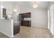 Kitchen with dark cabinets and tile floors at 137 Alpharetta Ct., Conway, SC 29526