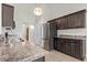 Spacious kitchen with stainless steel appliances and dark wood cabinets at 137 Alpharetta Ct., Conway, SC 29526