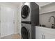 Laundry room with a stackable washer and dryer, and a utility sink at 137 Alpharetta Ct., Conway, SC 29526