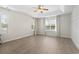 Bright and airy main bedroom with large windows and wood floors at 137 Alpharetta Ct., Conway, SC 29526