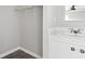 The bathroom provides a white vanity with marble-look top and modern hardware at 1533 Sand Dollar Ln., Garden City Beach, SC 29576